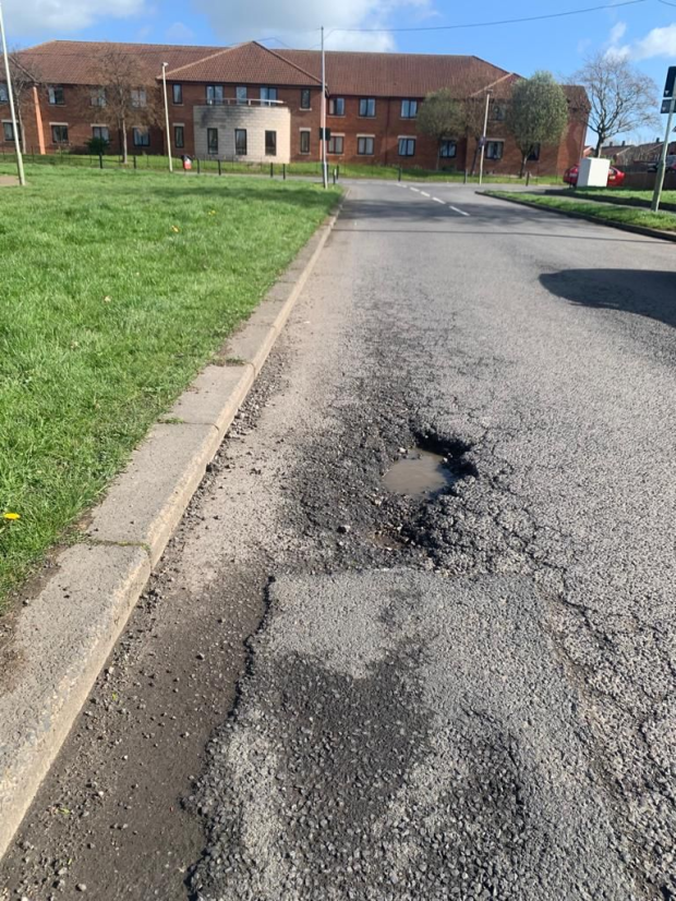 PolitlcsUK's tweet photo. 🚨 | NEW: Rishi Sunak's stare at a pothole two weeks ago still hasn't been fixed... and has actually got a lot deeper 

[@JackElsom] https://t.co/oIlrPZZQeN