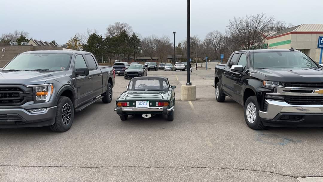 <a href="/TheBishF1/">Matt Bishop 🏳️‍🌈 🏁</a> Triumph spitfire in American car park