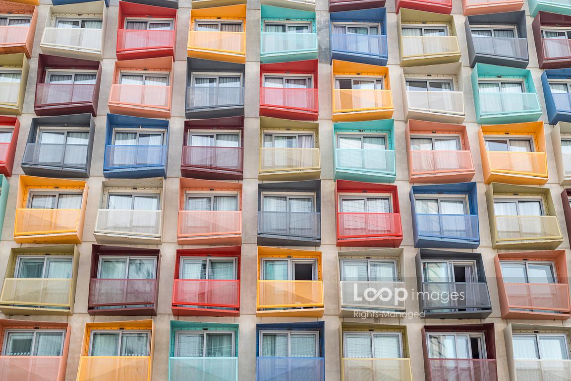 Multi coloured balconies seen outside a hotel in Spinola Bay in Malta #jasonwells #multicoloured #flats #balcony #rainbow #malta