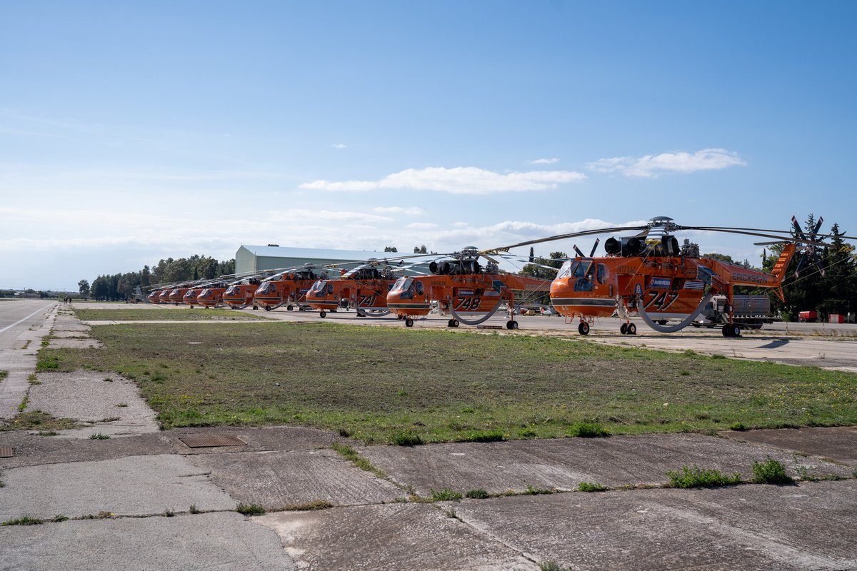 EricksonInc's tweet photo. What do you call a group of Air Crane® helicopters? Throwback to Greece 2021 with 10 #AirCrane helicopters basking in a group shot. Having a group of our aircraft together like this is a rare sight, as we are often utilized in different locations around the world. #Aerialfire https://t.co/7IyfAi77CZ