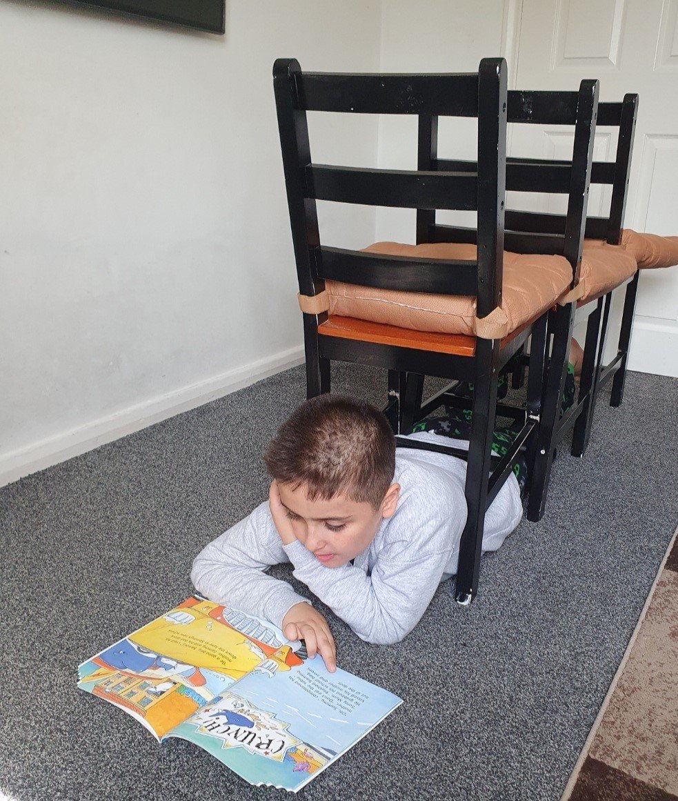 NottmPrimary's tweet photo. Shano has embraced our reading challenge and  found some really unusual and interesting places to read, as well as taking the time to read with his younger brother
#readingrolemodel #readingforpleasure https://t.co/fhUobs98y0