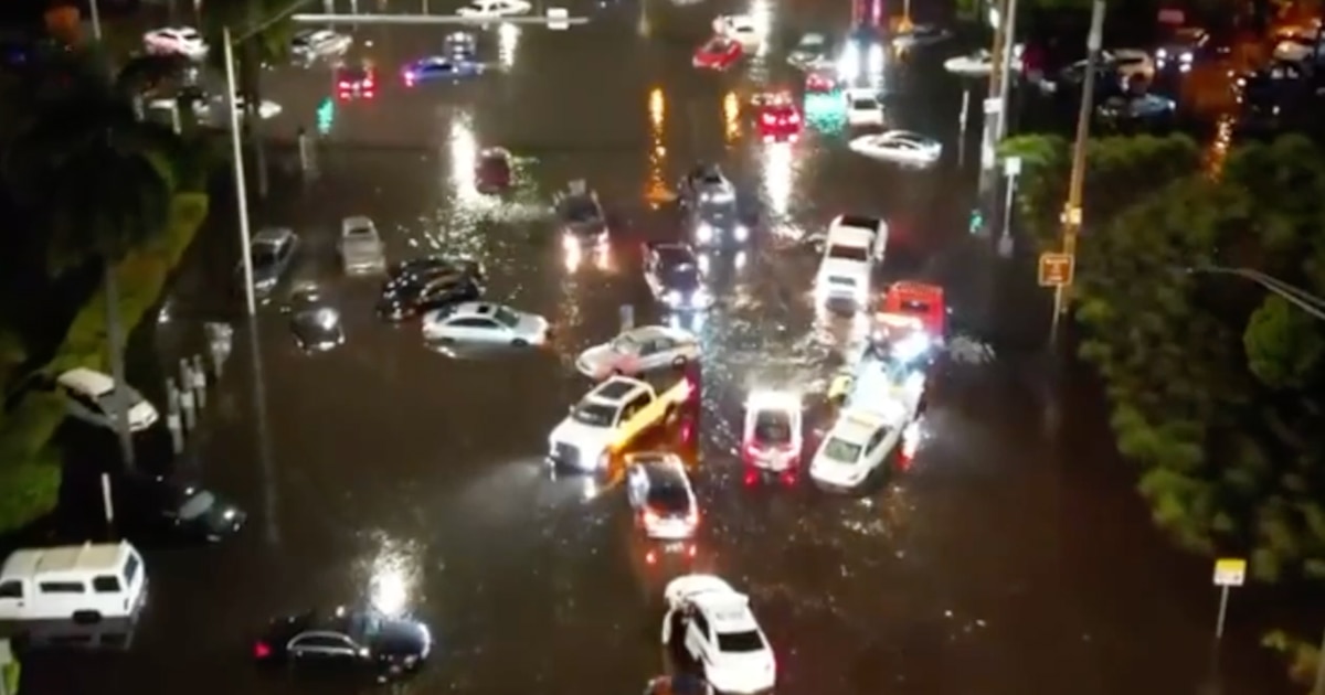 SunSentinel's tweet photo. Watch: Stunning drone footage shows river of stranded cars on downtown Fort Lauderdale streets https://t.co/9qoAG0eEhh https://t.co/ku56OFN05G