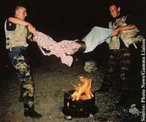 HistorySomalia's tweet photo. 1993 - Belgian soldiers holding a Somali child above a fire roasting him alive in #Mogadishu. They were part of the 30,000 strong US led United Nations Mission Operation Restore Hope in Somalia. 

The soldiers were acquitted of all charges and deemed innocent in a Belgian court. https://t.co/h6SvsfiBAU