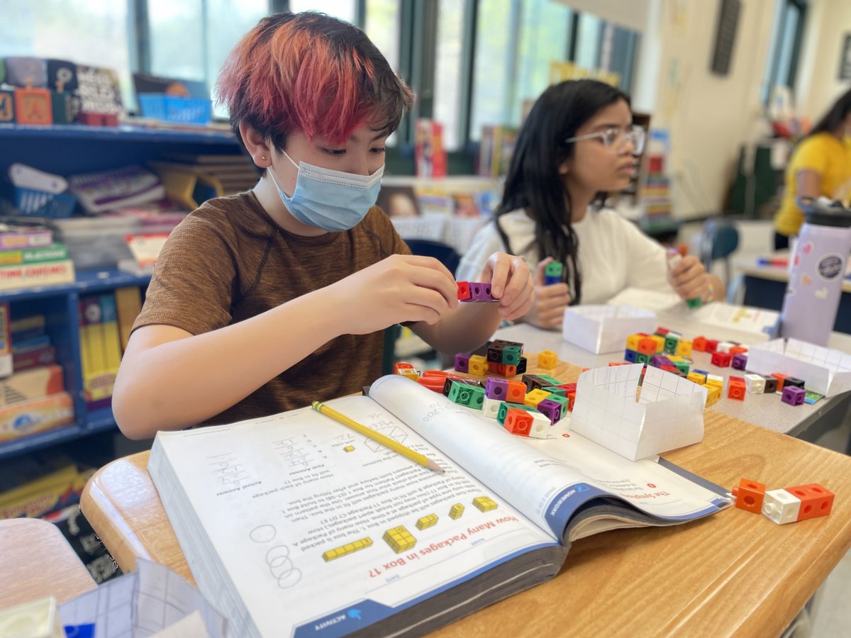Nyack_Schools's tweet photo. How many boxes will fit?
Fifth graders at Valley Cottage ES are using their powers of observation to predict the volume of a shape. After building three-dimensional boxes, students then used #MathLink cubes to calculate the actual space. #NyackSchools #Mathematics https://t.co/rEri2lulyn