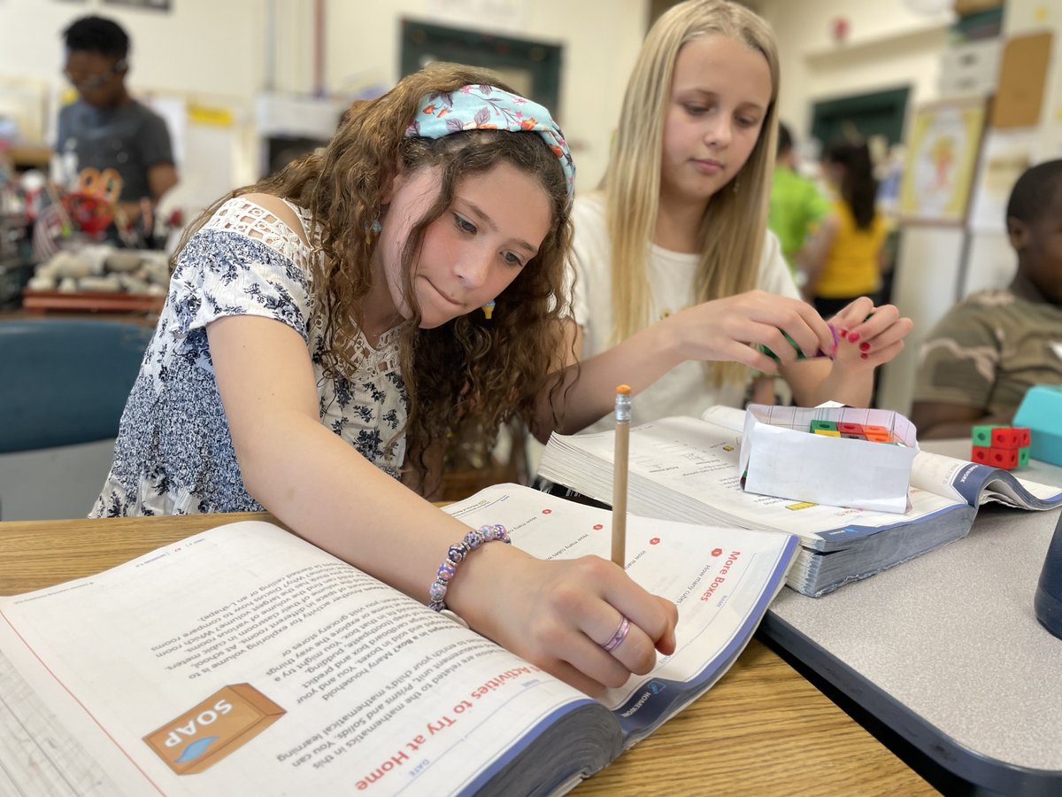 Nyack_Schools's tweet photo. How many boxes will fit?
Fifth graders at Valley Cottage ES are using their powers of observation to predict the volume of a shape. After building three-dimensional boxes, students then used #MathLink cubes to calculate the actual space. #NyackSchools #Mathematics https://t.co/rEri2lulyn