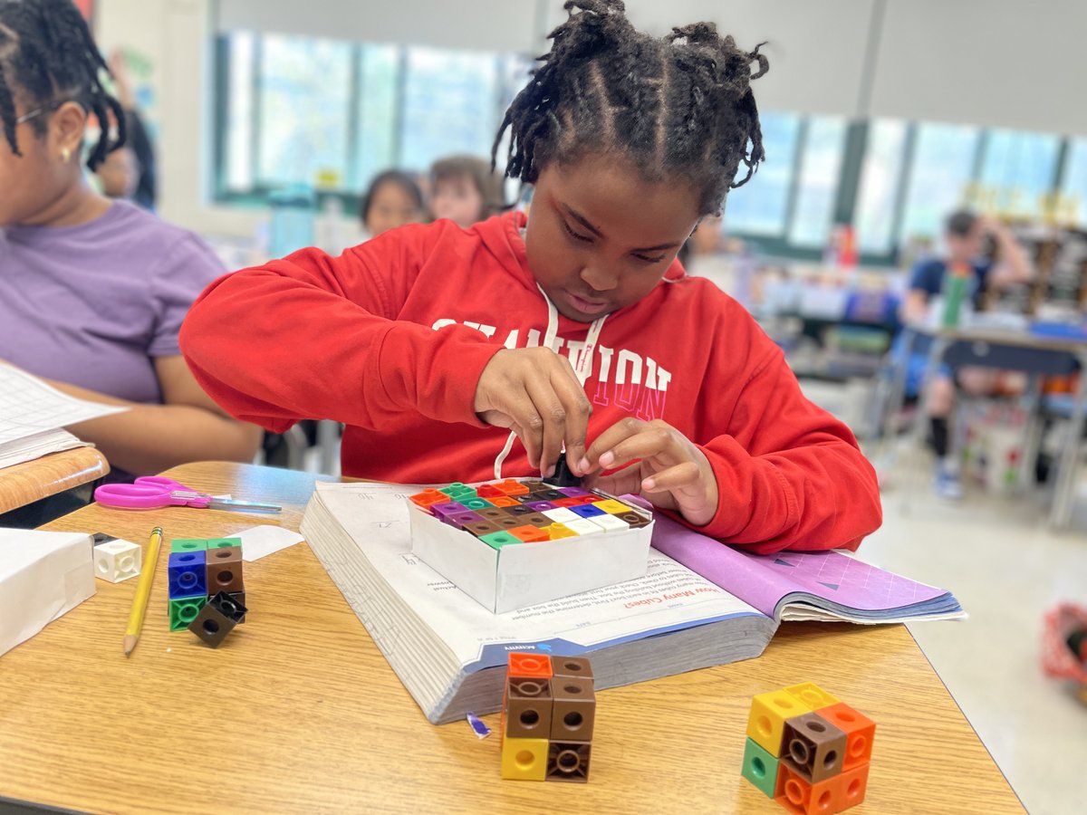 Nyack_Schools's tweet photo. How many boxes will fit?
Fifth graders at Valley Cottage ES are using their powers of observation to predict the volume of a shape. After building three-dimensional boxes, students then used #MathLink cubes to calculate the actual space. #NyackSchools #Mathematics https://t.co/rEri2lulyn