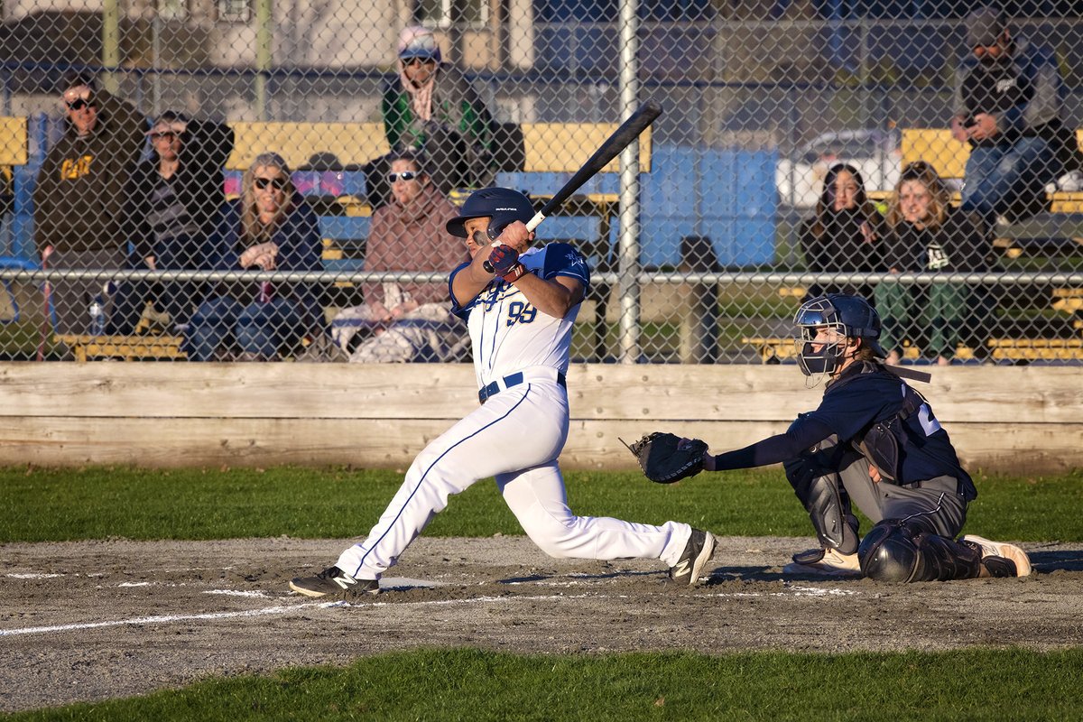 Royals SS Derick DeVera hits a double vs Chilliwack.