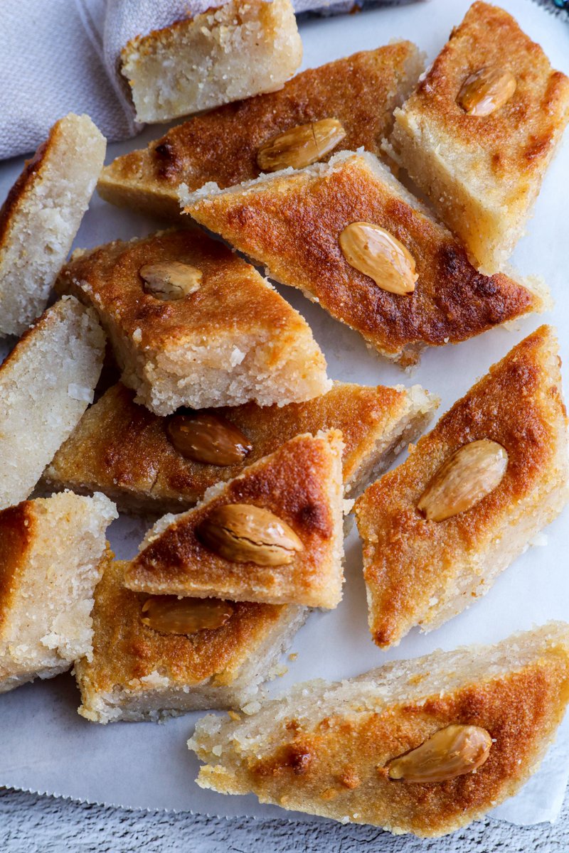 BestofVeganLLC's tweet photo. Indulge in this luscious #vegan coconut semolina cake. Drenched in rosewater syrup and topped with almonds, this dessert bt @plantbasedarab is an irresistible treat to savor with coffee or tea. 

RECIPE: https://t.co/Py6ynKF6E3 https://t.co/gaOWV4RtSV