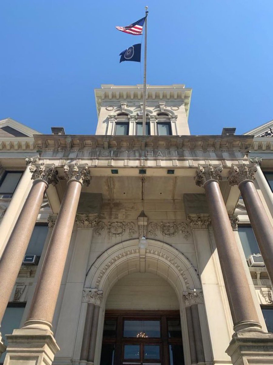 Profdilipmandal's tweet photo. While most Indians were fast asleep, Jersey City in the US made history on Ambedkar Jayanti. A blue flag with the Ashoka Chakra and the American flag was raised at the City Council Hall, in the presence of council officials and a representative from the Indian consulate. #Jaibhim https://t.co/r4clPLBSB0