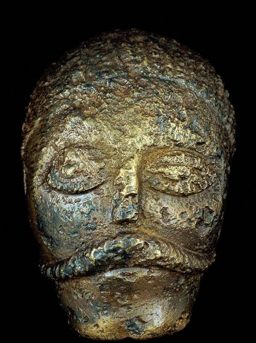This eerie &amp; very rare image shows the face of an Iron Age British man.  It dates to between 50-20BC and was found in a cremation burial near #Welwyn, #Hertfordshire, #England. It was one of three small bronze models of men's faces that were the decoration on a wooden bucket.