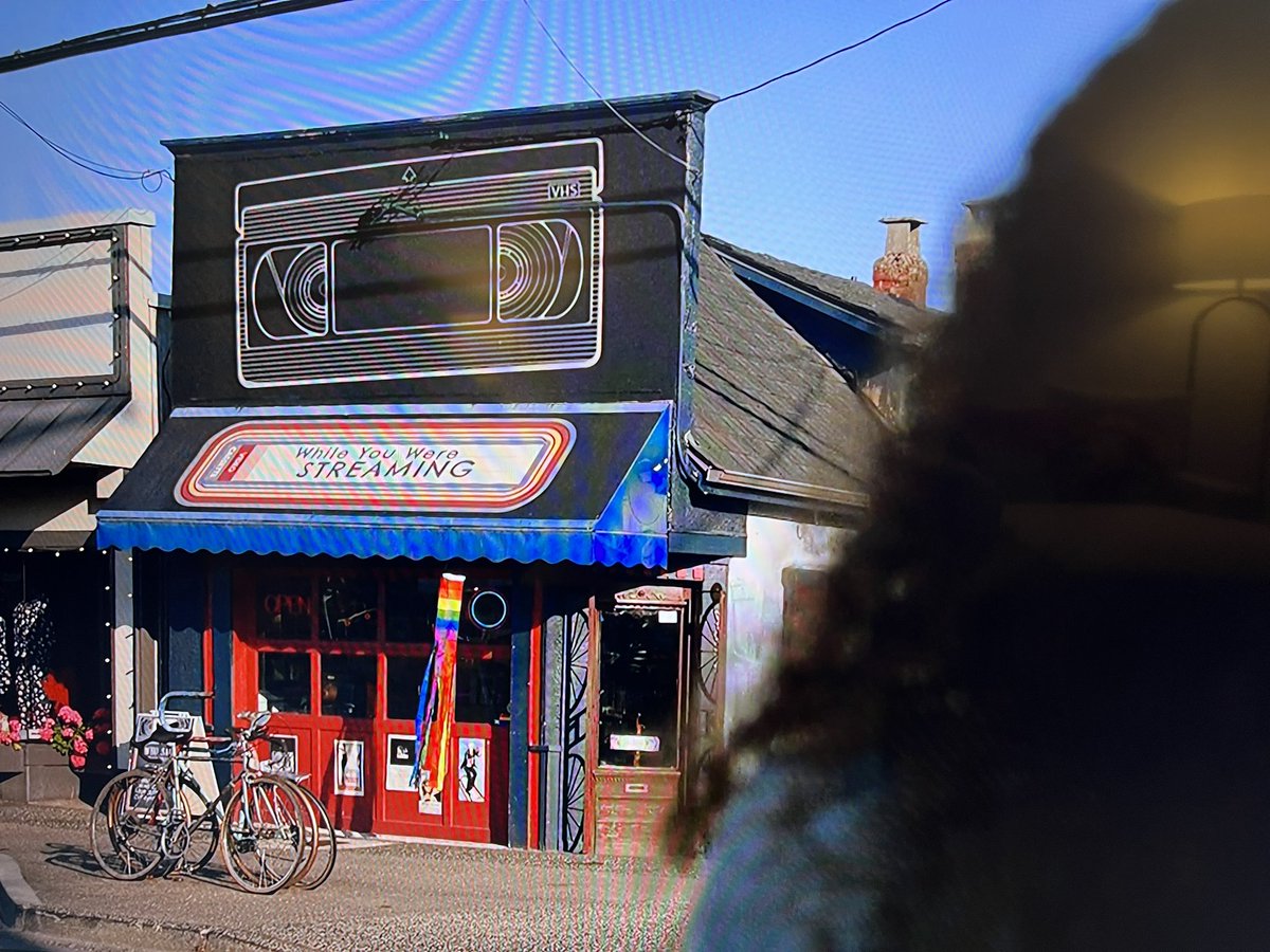 MaryLeishman's tweet photo. Not the Yellowjackets writers naming Van’s video store ‘While You Were Streaming’ as a nod to Van talking about ‘While You Were Sleeping’ in season 1😭😭😭 #Yellowjackets @yellowjackets96 https://t.co/Us3mMonjdm