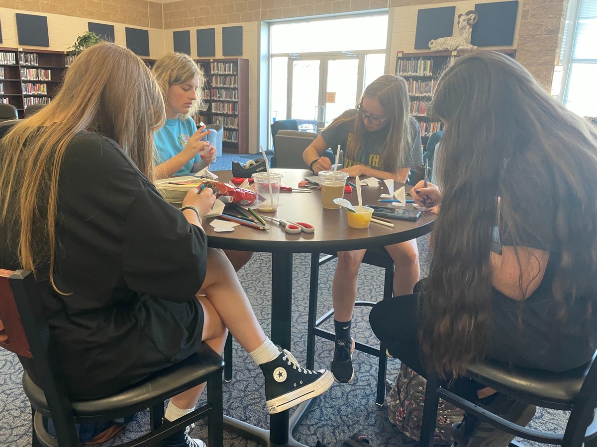 KD Media Center--Mr. Meinl's students make inside out projects where three pyramids make a cube.  Each student chose a theme to decorate his or her creation.