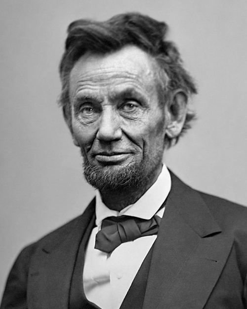 Photo of a gaunt Abraham Lincoln with a faint smile.