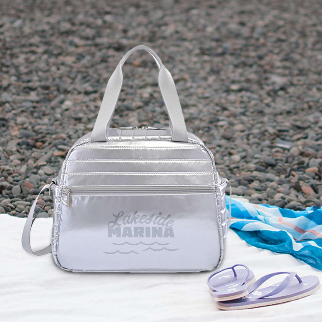 Perfect for the office or adventuring on the weekends, carry lunch and snacks with a touch of metallic flair. They’ll love this sleek quilted duffel cooler—with your branding on the side—with plenty of room for food, drinks, cash, keys, and other essentials!