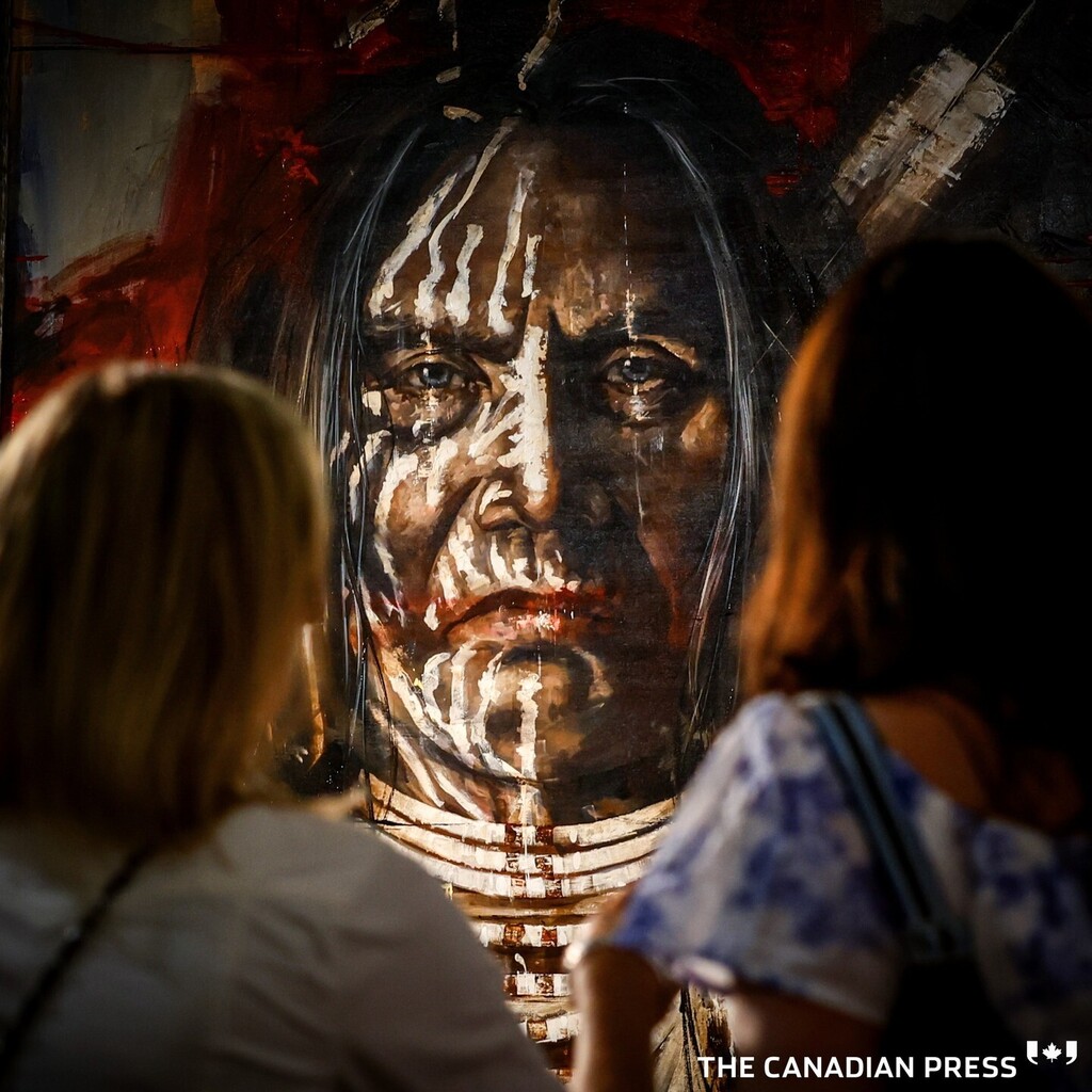 Patrons view a painting of an indigenous warrior on display at the Calgary Stampede chuckwagon canvas auction in Calgary, Thursday, April 13, 2023. This year's Stampede runs from July 7-16. THE CANADIAN PRESS/Jeff McIntosh
.
.
.
.
.
.
#CalgaryStampede #S… instagr.am/p/CrBQzq4r6O4/