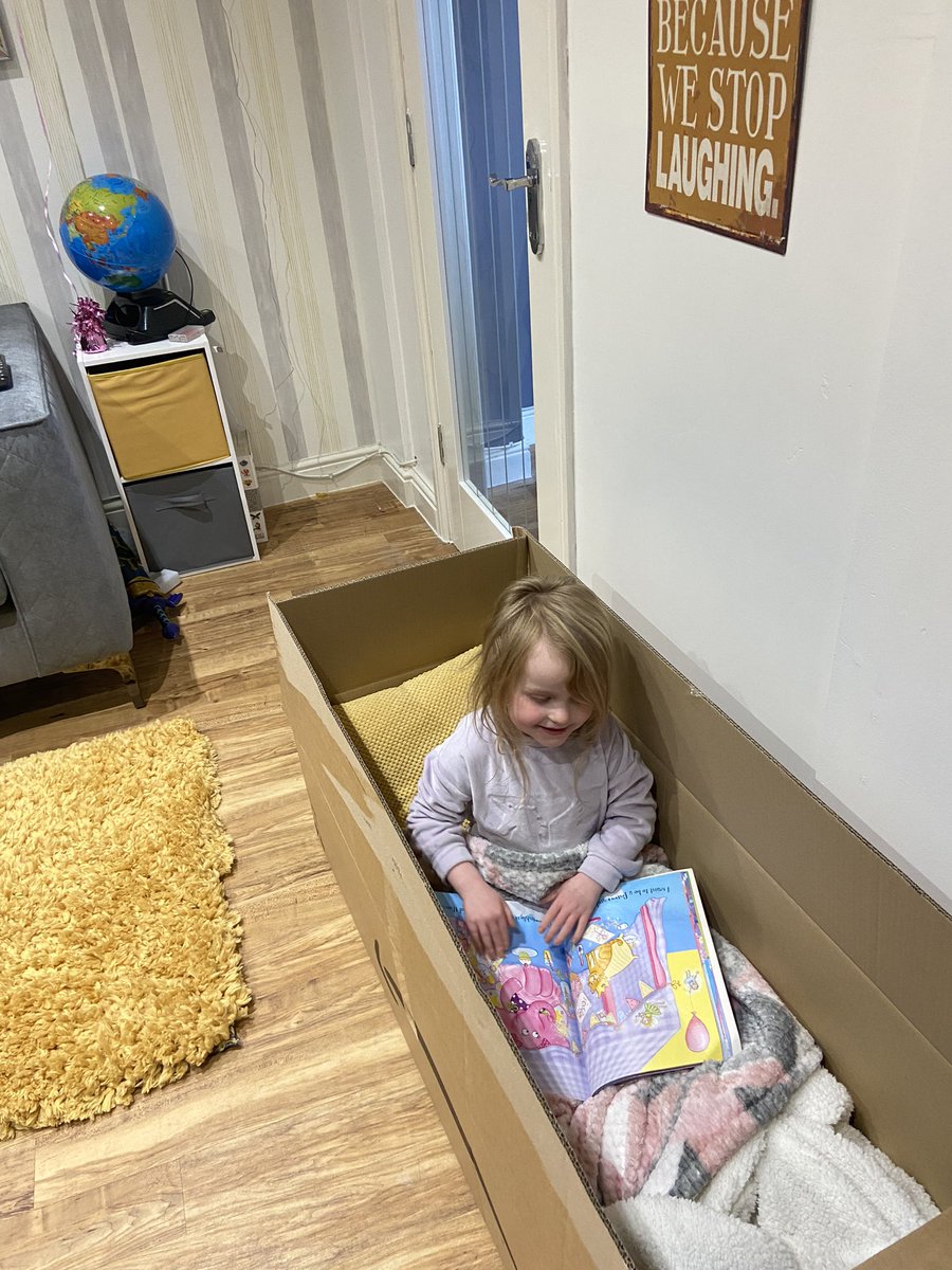 LangmuHol's tweet photo. @stbartsRWB Isla has finished her EYFS Easter challenge today - she decided to do her ‘reading in an unusual place’ in a big box that she made cosy with a cushion and blanket! https://t.co/D9oysvm3x2