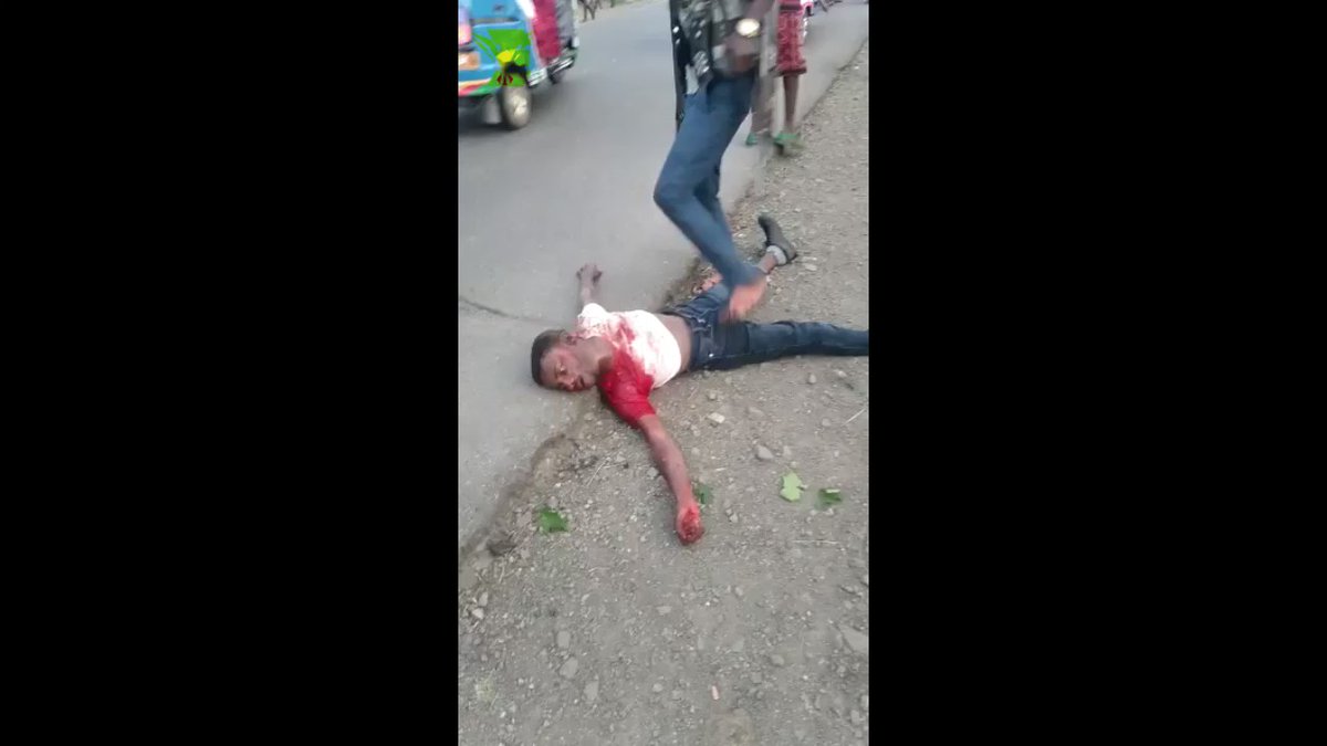 GPEthiopia's tweet photo. #GPE_AtrocityReport
#DevelopingSituation
WARNING: Attached videos and pictures are extremely graphic!

April 14, 2023

A total of three mini buses full of people were attacked on three spots yesterday on route from Dessie to Debre Birhan. All 45 civilian passengers are presumed dead. From the passengers killed, some of the passengers were members of the Amhara Special Forces that were made to disarm by the recent Federal Government directive. 

The disarmed Amhara Special Forces were on their way to Shoa Robit, Debris Sina and Debre Birhan to celebrate the Easter holiday with their families. Two of the three spots where the attacks took place are Gerbina Barchi in the Oromo Special Administration of Amhara Region, Jawa area in North Shoa Zone of the Amhara Region.  These horrific killings of ethnic Amharas at the hands of OLA terrorists is never investigated or even reported by any government media, in fact Oromo Regional State officials often blame the victim Amharas despite their horrific death. 

The Amhara Regional Government was directly responsible for their murder, as they implemented the unconstitutional order to unilaterally disarm Amhara Regional Forces despite the region being under TPLF and OLF attack for the entire five years since the ruling party claimed to reform.

*Addendum 
In one of the videos of the atrocity that was released by the perpetrators (OLF terrorists) themselves, they can be heard saying the following in the Oromo language:

>> A woman pleads: "he is already dead" when the killers kept on disparaging one of the bodies of the the Amhara individual they killed. Right after she said that one of the killers is seen throwing a large stone on the face of the deceased. 

>> then the person recording the video, confirms to the one violently throwing a rock on the face of the victim "[SIC]I didn't show your face"

>> The perpetrator responded " No problem". 

This tiny bit of the massive body of evidence for #AmahraGenocide showed that the perpetrators have no fear of being kept accountable. The reason these horrific evidences of targeted killings surface is primarily because the perpetrators self-incriminate themselves believing no one will keep them accountable. Rather by disseminating their treatment of Amharas they aspire to cower Amharas all over the country to keep silent about the pain they are going through. This is a typical genocidal procedure for those who aim for complete domination of those they did not manage to kill yet.