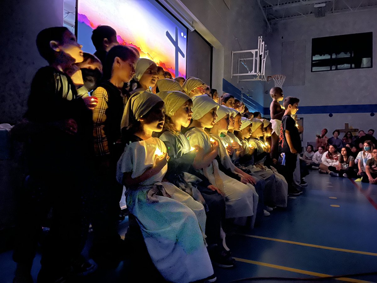 MmeLafrance's tweet photo. It’s been a very special Easter Week. Thanks to the Grade 5s we participated in a lovely Easter Liturgy and we were blessed with a beautiful presentation of the Stations of the Cross performed by the Grade 1s. I’ve included the students’ creative Easter dot art too! #STMWolfpack https://t.co/oVGCrW0CBm