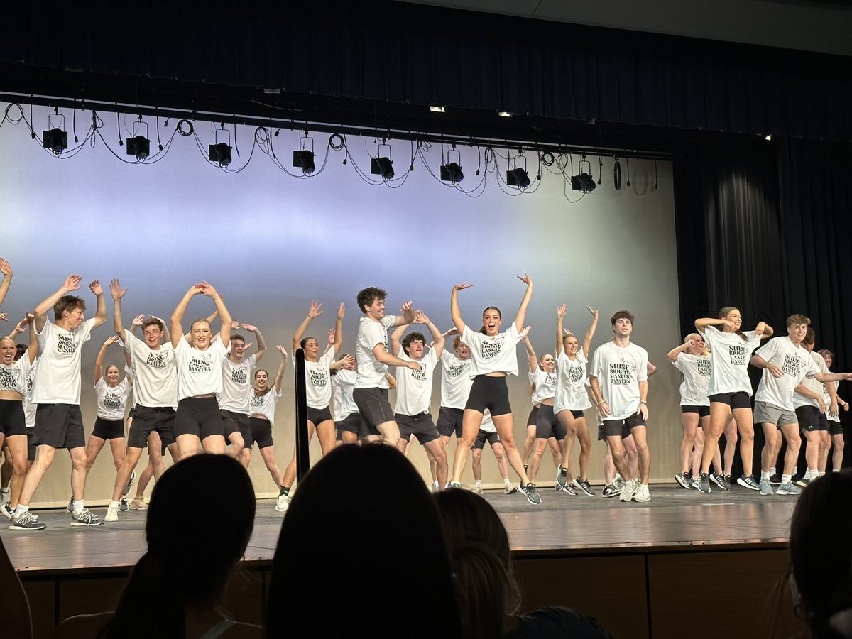 Mancer Dancers join the senior girls on stage in a group dance.