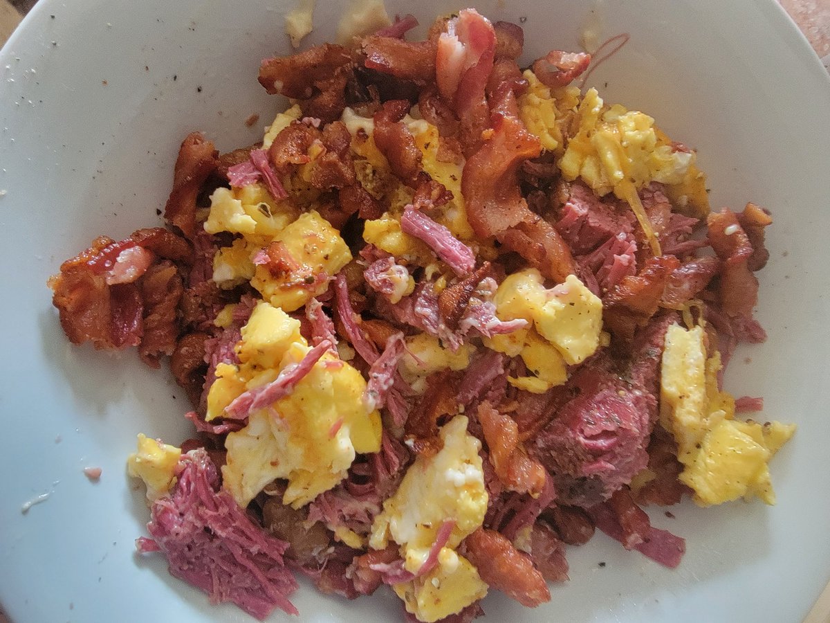2_fists's tweet photo. Added bacon to my eggs and corned beef for the first time, and it was extra delicious. First time frying the bacon twists, and I was pleased that I could fry 2x the amount in the time it takes to fry flat.  Surprised how evenly they cook too. #keto #carnivore #protein #fat https://t.co/iH2DlERyBM