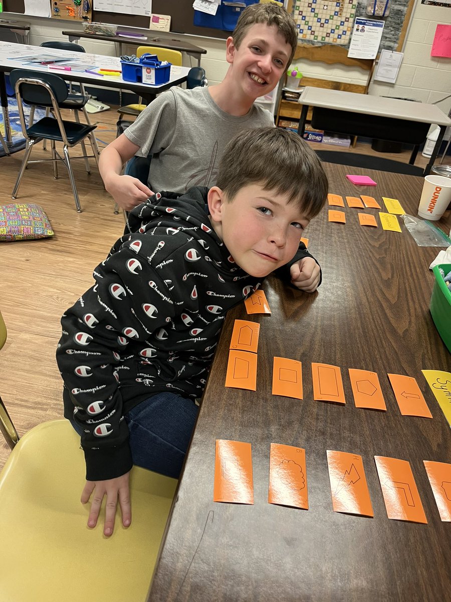 BelkoferMrs's tweet photo. Reviewing some long division and sorting shapes based on their symmetry for some #handsonlearning in math today! https://t.co/V7tlBJfZ0m