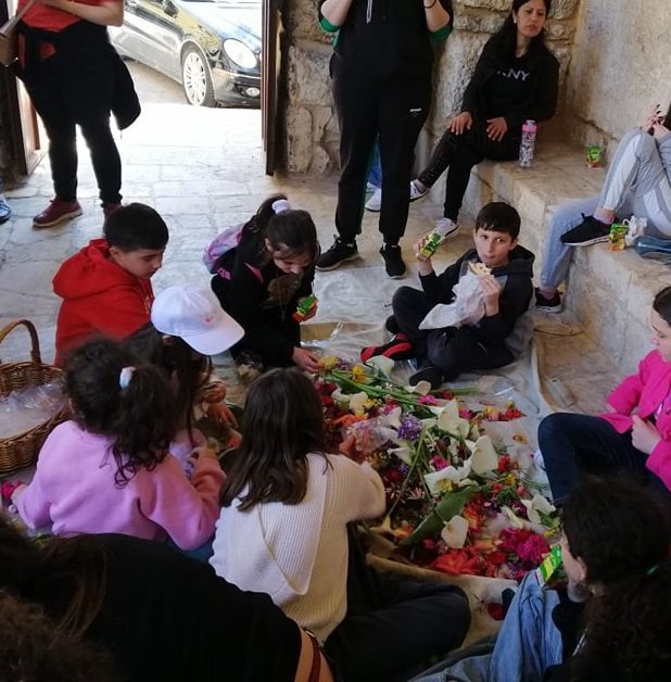 GrecoLevantines's tweet photo. Children in #Amioun, Lebanon collect flowers to adorn the Epitaphios of Christ, reflecting the beauty of Greek Levantine traditions. They wander the streets and gardens for hours and then gather in the church to complete the decoration. https://t.co/ZURSYcWfqD