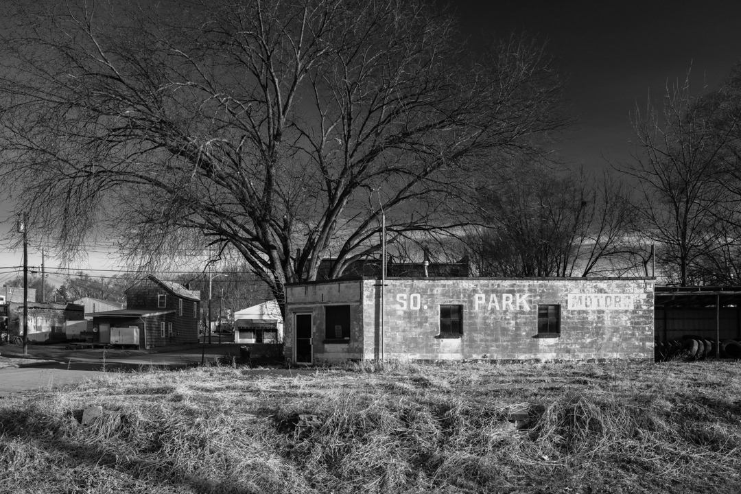 Abandoned auto sales building in St. Joseph, Missouri. Photography by Notley Hawkins. #missouri #building #newtopographics #autosales #midwest #abandoned #monochrome #blackandwhite #grayscale #stjosephmo #notleyhawkins