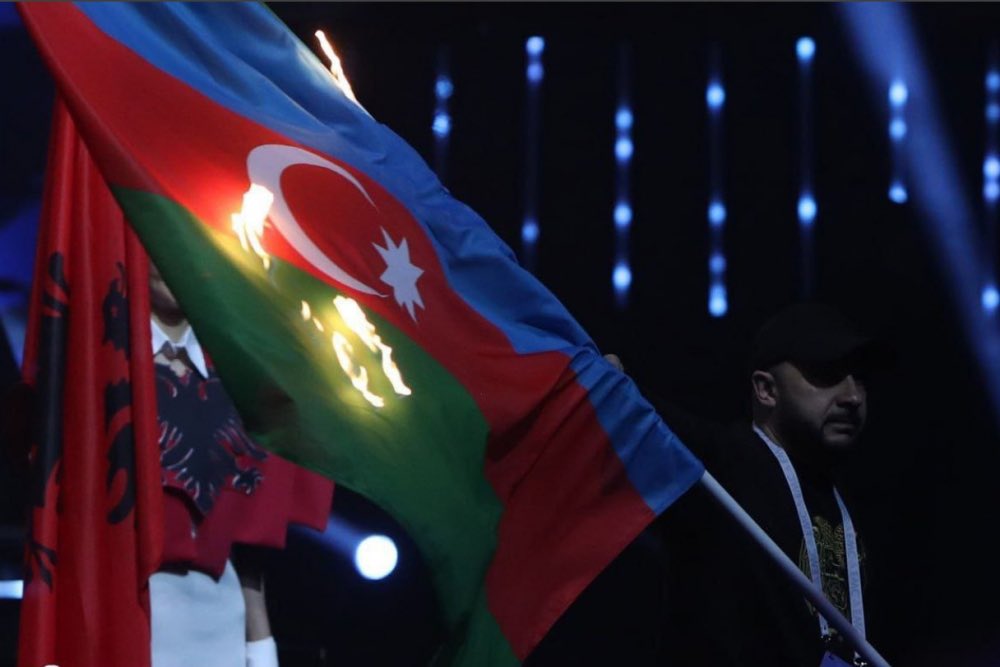 CaliberEnglish's tweet photo. ‼️ Attention! #Armenia took #Azerbaijani athletes hostage!

The plane on April 14 flew to #Türkiye without them. Can “#Yerevan 2023" repeat "#Munich-1972"?

 ◾️After yesterday's #flag burning incident in Yerevan, the Azerbaijani weightlifting team decided not to take part in the #European Weightlifting Championships, which are taking place these days in #Armenia.

 ◾️Tickets for the #Yerevan-#Antalya flight were booked for our team.  At 02.55 am, the members of our team were supposed to fly to Antalya & then to #Baku.

 What happened next?
 ◾️The Armenians, under the pretext of "security", did not let our #team out of the hotel.  In fact, they are holding our #national team hostage after their  refusal to participate in competitions.  All this is happening after the #burning of the Azerbaijani flag at the event, which was personally inaugurated by PM #Pashinyan & attended by the presidents of the World & European Weightlifting Federations.

 ◾️What's next? Is "Munich -1972" going to be staged in Yerevan?  Recall that in that year there was a #terrorist attack at the Munich Olympics, committed by members of the terrorist Palestinian organisation Black September, the victims of which were 11 members of the Israeli Olympic team (4 coaches, 5 competitors & two judges) & one West German #policeman. Given the traditions of Armenian terrorism & the latest #video of mistreatment of the Azerbaijani prisoner of war, who was severely beaten in Armenia, urgent measures must be taken to release our team #CaliberAz