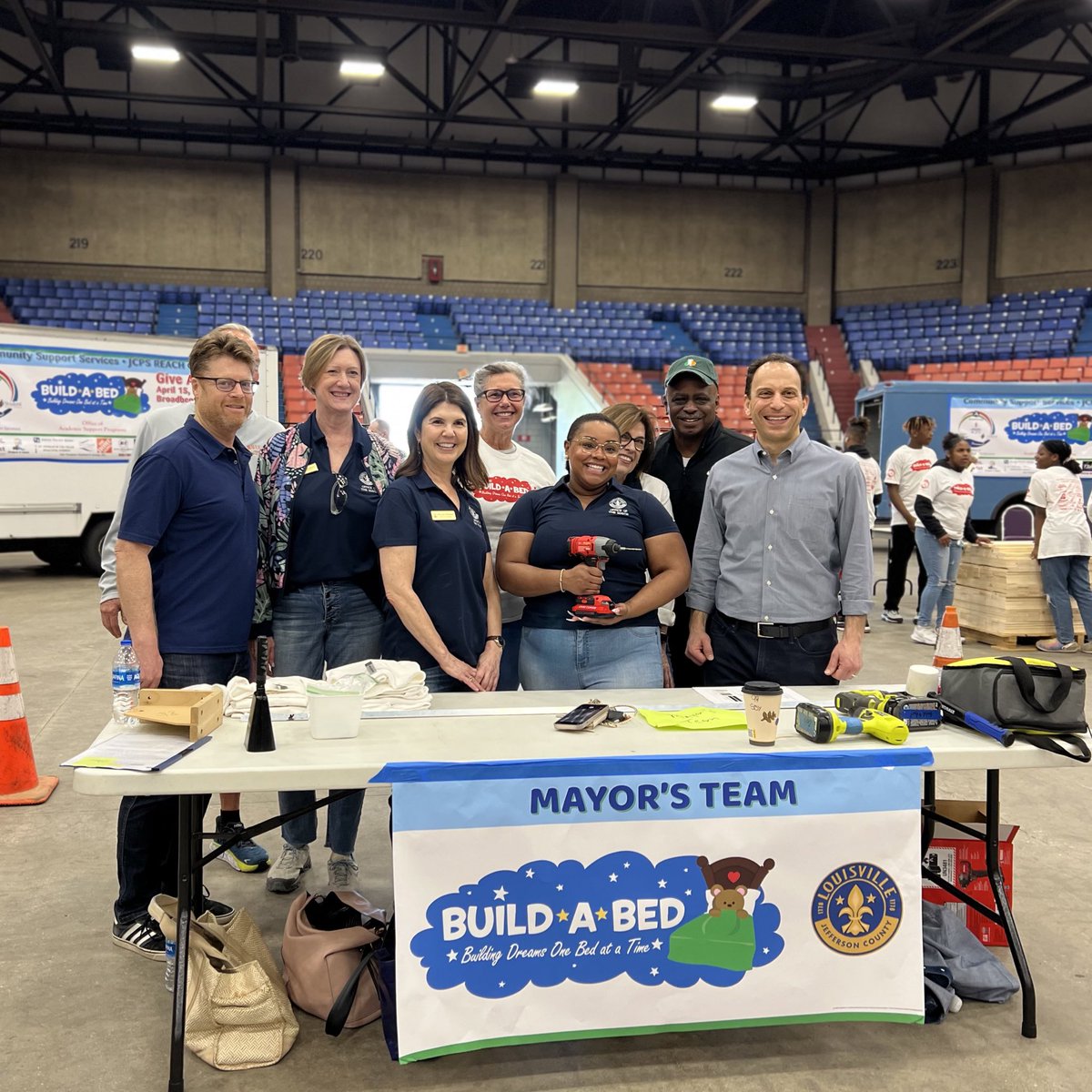 LouisvilleMayor's tweet photo. Building a brighter future for our community, one bed at a time. Proud to support the Build-A-Bed project, which provides a safe and comfortable place to sleep for @JCPSKY students in need. Thanks to everyone who's come together to make this annual tradition a success! #GiveADay https://t.co/lxpFWWGtpL