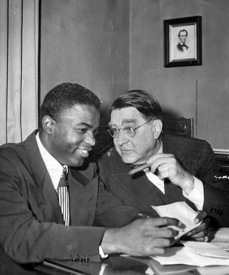 Jackie Robinson with Branch Rickey signing his contract. #JackieRobinsonDay