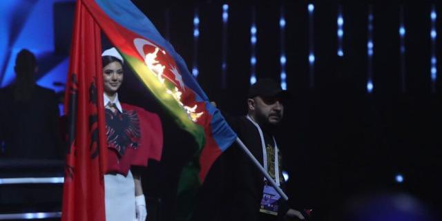 Armenia is hosting the European weightlifting championship. During the Parade of Nations where flags of participating countries are presented, Aram Nikolyan, an Armenian designer and stylist, burned the Azerbaijani flag.