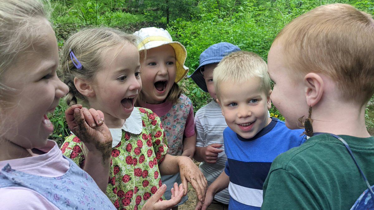 TheBruderhof's tweet image. Living on the edge! Daring each other to try crawdad earrings. #Adventures #NatureFun