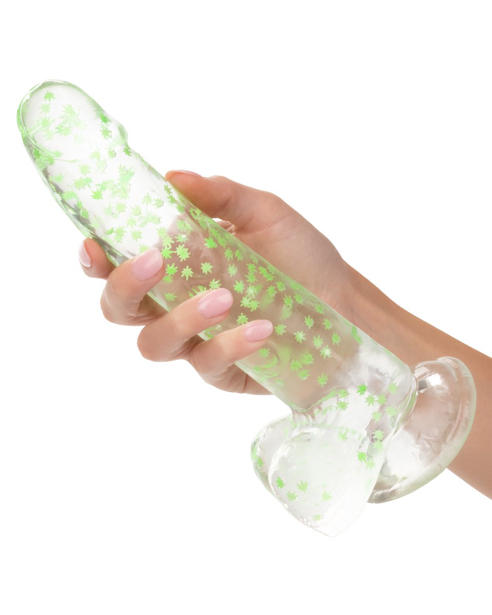 RealNaughtyBits's tweet photo. Our new “I Leaf Dick” glow-in-the-dark weed leaf dong is a total smoke show! It’s realistic, textured, and filled with weed leaf confetti, with a suction cup base. Available now! @calexotics https://t.co/NUdaSS4bOe