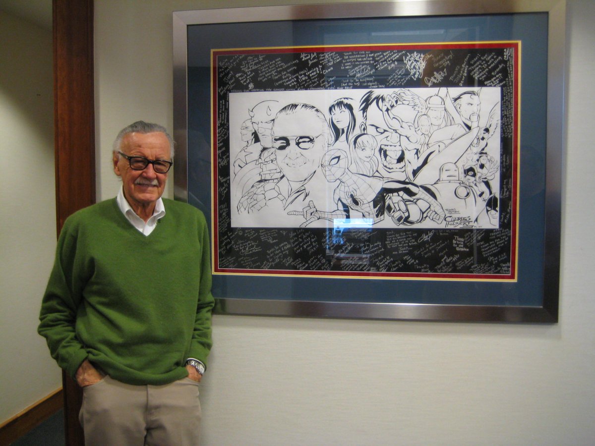 TheRealStanLee's tweet photo. Stan admired artists, from those he worked closely with to the fans who created sensational Stan art. Here’s a flashback of him posing with a phenomenal piece crafted by Charles Holbert. #StanLee #WorldArtDay https://t.co/z5GHQJqn3U