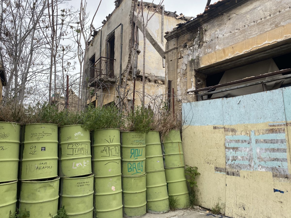 PadeeWhia's tweet photo. #padeewhia tour though the #bufferzone within Nicosia's medieval city. Barrels are used as a barrier at the #greenline in #nicosia, the world's last divided capital. #remembercyprus https://t.co/pIsBYPwZex