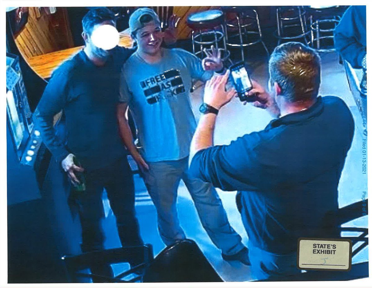 marty_taylorr's tweet photo. Kyle Rittenhouse is suing one of the men he shot for emotional distress and assault. That's right the little grifter  Rittenhouse has filed suit against a man he shot. Kyle is shown here celebrating soon after the shooting with his friends the Proud Boys. Even flashing their gang sign to prove his loyalty to the Proud boys. Does this look like a man who has just been assaulted and is suffering  "extreme emotional distress". Maybe hanging out with anti American traitorous racists the Proud Boys cheers him up.