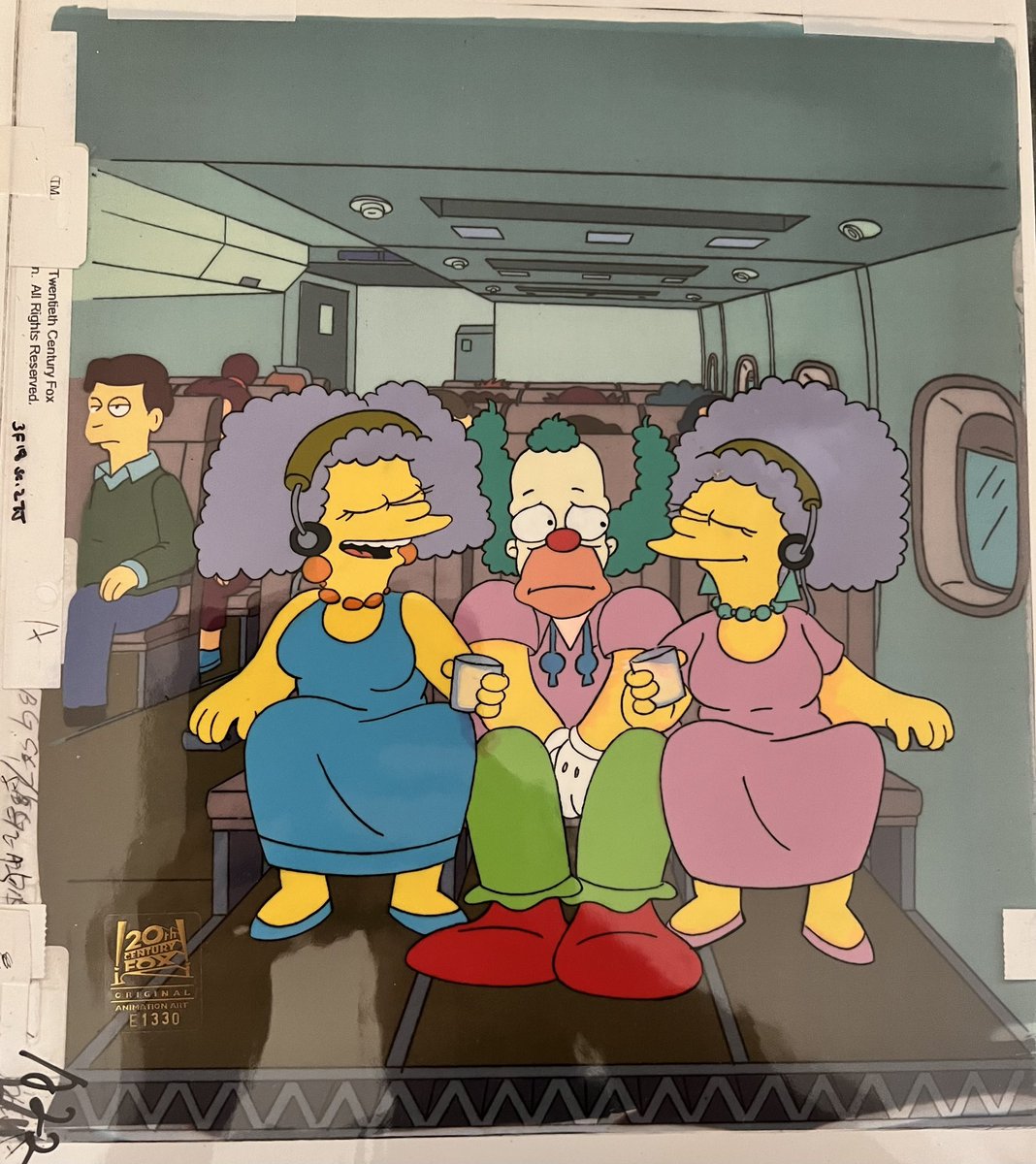 Joshstrangehill's tweet photo. I was asked again about the Ralph/Krusty-in-a-plane short we cut for time from "22 Short Films About Springfield"

Here it is, along with a rare cel from that scene of Krusty sitting between Patty and Selma as they sing https://t.co/AA0PWlSc4b
