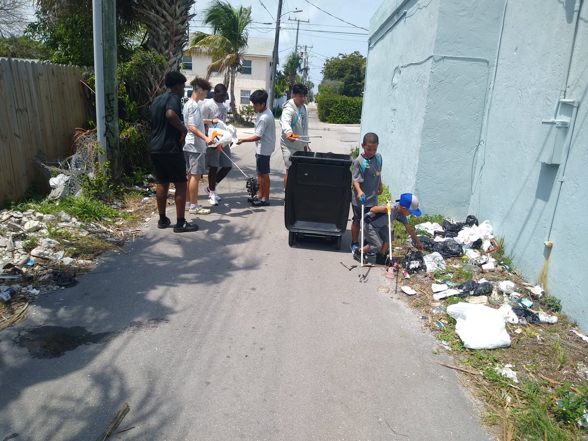 LakeWorthFBall's tweet photo. Trojans Football community service outreach. Cleaning up our community with the Tropical Ridge Neighborhood Association. https://t.co/Qj3m00aqR2