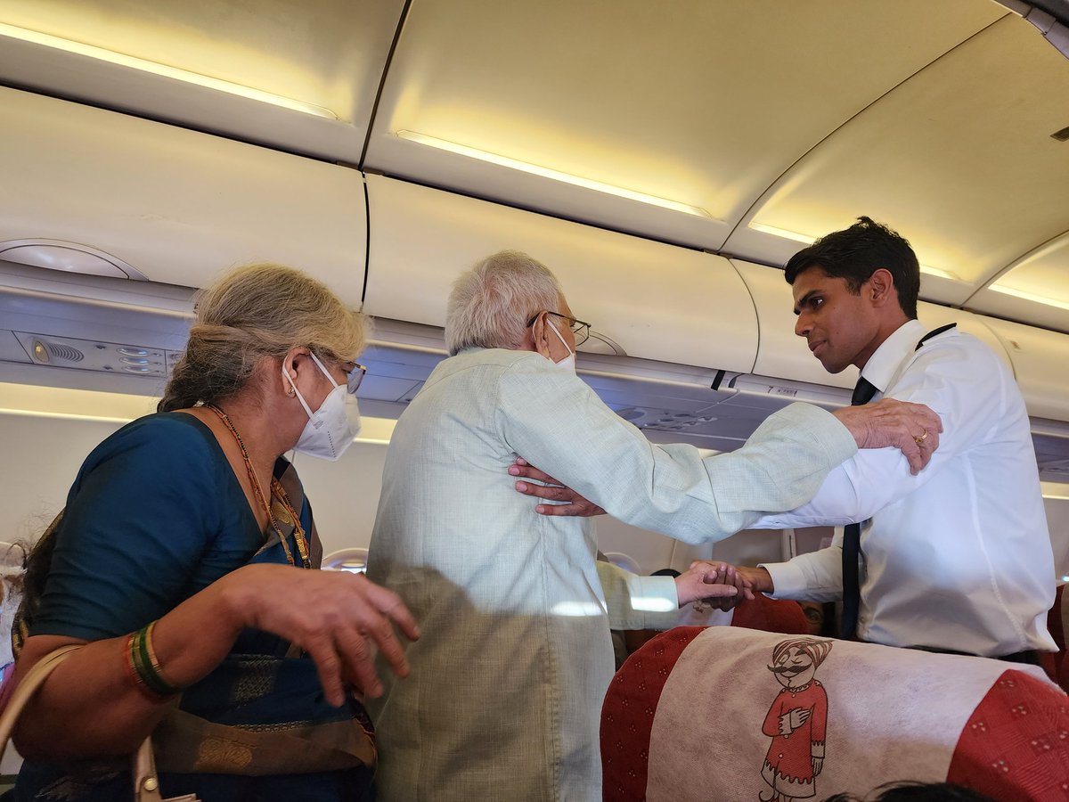 MANTRIKK's tweet photo. @airindiain  AI456 Vishakapatnam to del. AI flight attendant Mr. Naveen taking care of one senior citizen couple.#Human touch https://t.co/j6kEdbpjqd