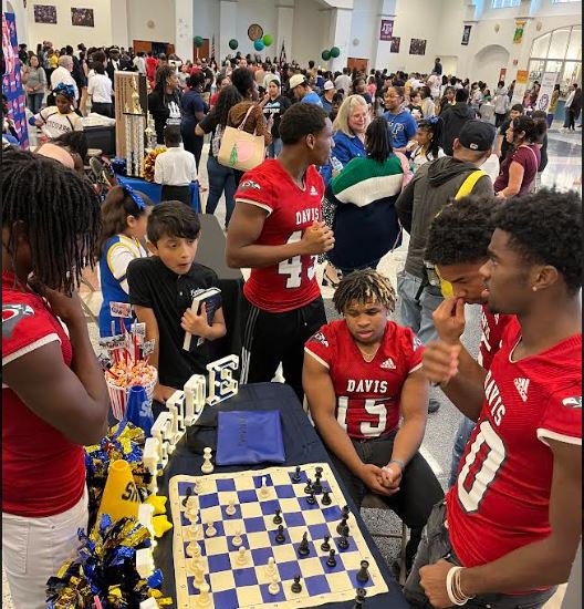 Carmichael_AISD's tweet photo. Pictures from our time at the Davis HS Vertical Community Meeting! After our  Cougars said the welcome and pledges, our students watched a few Davis HS football players play chess! https://t.co/zCVnDkso5g