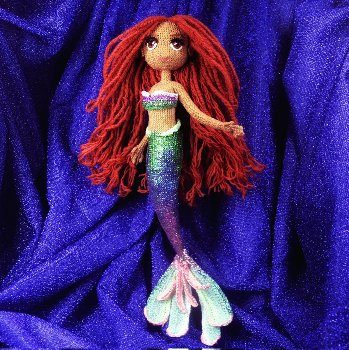 A part of your world 🧜🏾‍♀️🌊✨ My very first crochet mermaid, as inspired by the live remake of The Little Mermaid, starring the beautiful and talented @HalleBailey 😍💕 I'm in love with the ginger locs and obsessed with her glittery tail! All handmade with love 🫶