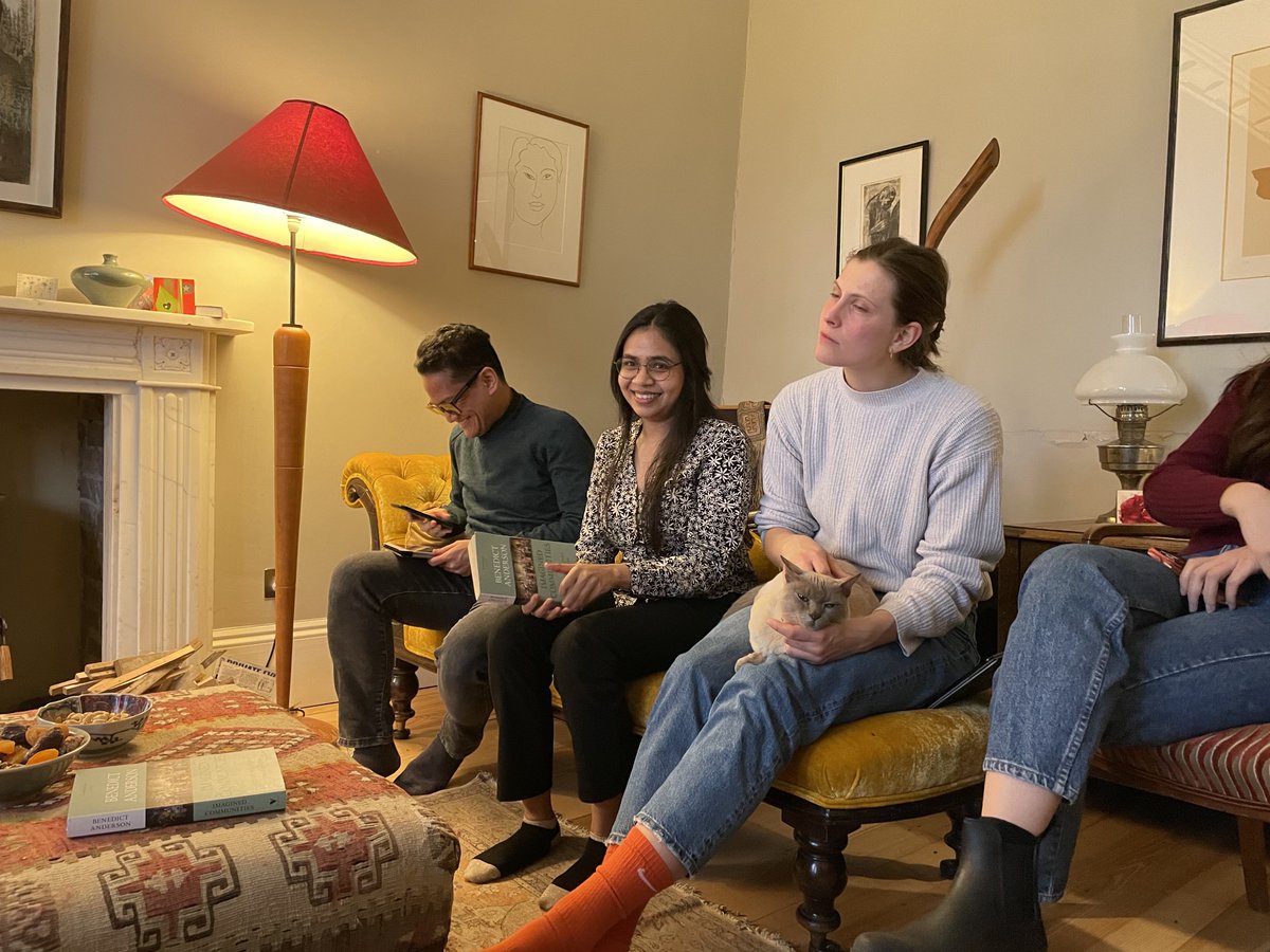 Fernanda_Pirie's tweet photo. What can Anderson's 'Imagined Communities' bring to socio-legal studies? Members of the @OxfordCSLS reading group have lots to discuss - Hong Kong, post-colonial China, modern Indonesia, French and British literature. With an interested cat. https://t.co/GbUfXkZuf3