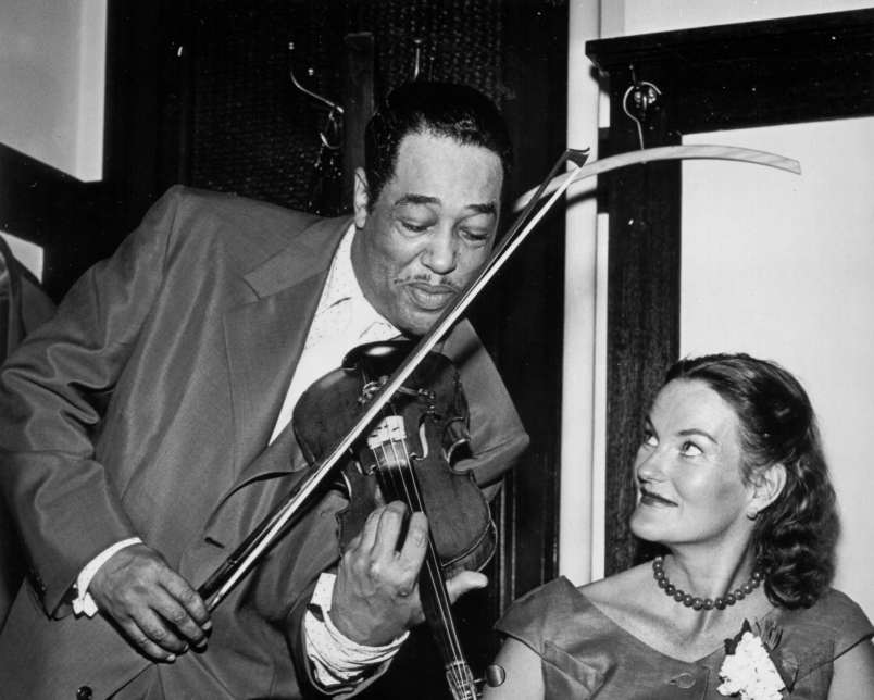 DorisDukeFdn's tweet photo. How did it all begin? Doris Duke's love for #jazz inspires #DDF's ongoing support for the music and the artists who make it. In the image below, she is pictured alongside the legendary Duke Ellington as he plays the violin. https://t.co/bwcgvfV7el