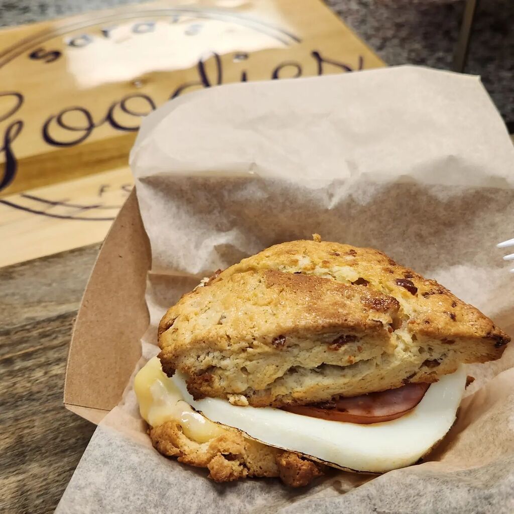 If you haven't had one of these scone sandwiches from <a href="/sarasgoodiesllc/">Sara Weaver</a> yet... trust us, you really want to! Start by choosing your scone (bacon cheddar chive, basil parmesan, etc. - this one is maple bacon), then add a farm-fresh egg, cheese and your cho… instagr.am/p/CrlbGfFuScG/