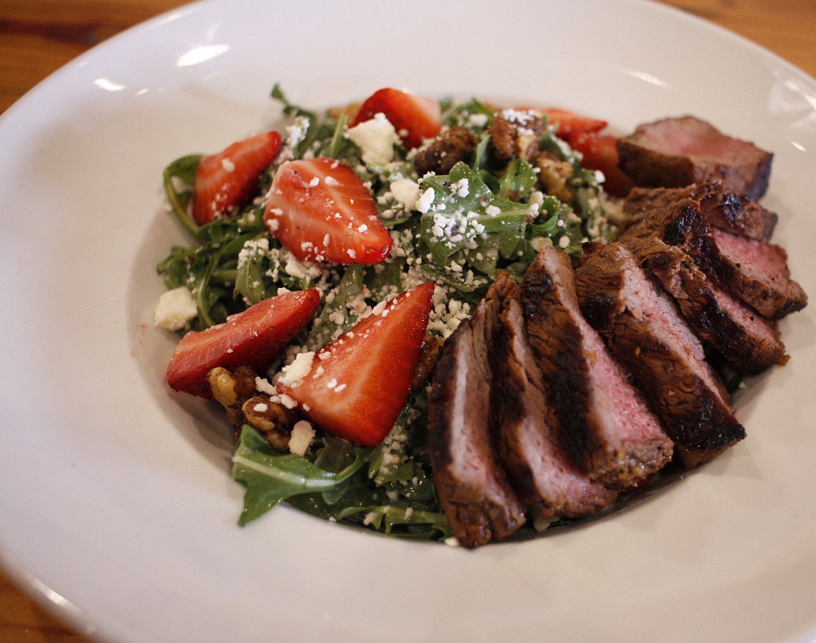Strawberry Steak Salad… Baby Arugula, Fresh Strawberries, Candied Walnuts, Feta Cheese, Creamy Poppyseed Dressing, and Grilled 4oz Tri-Tip Steak. Possibly the most perfect spring lunch dish in history today here in East Lawrence. #imwithlarry #downthestreetupyouralley