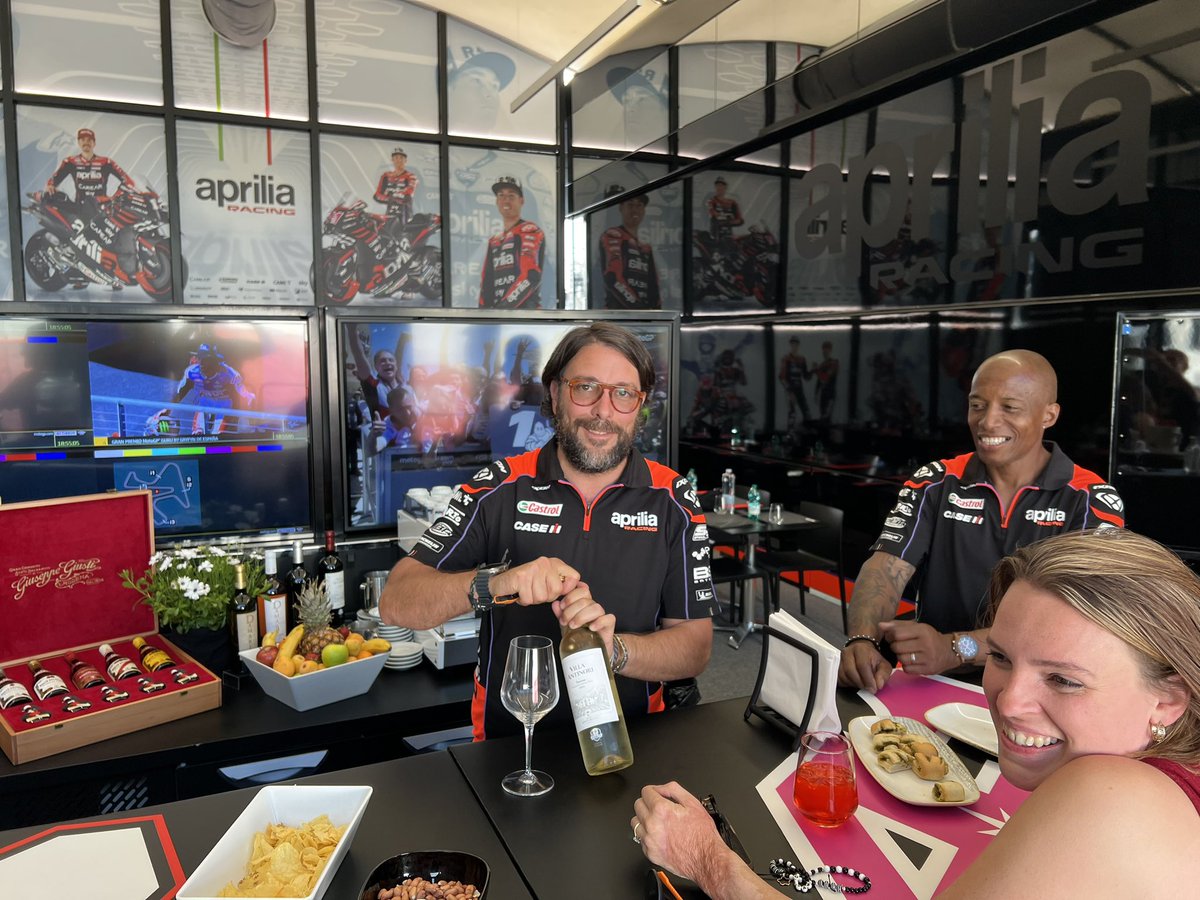 matoxley's tweet photo. My favourite barmen in the #MotoGP paddock: @PippoAskari and @integra_support and some lady I bumped into. This place would go bankrupt without us around 🤣🤣 https://t.co/MeKFeWcTkc