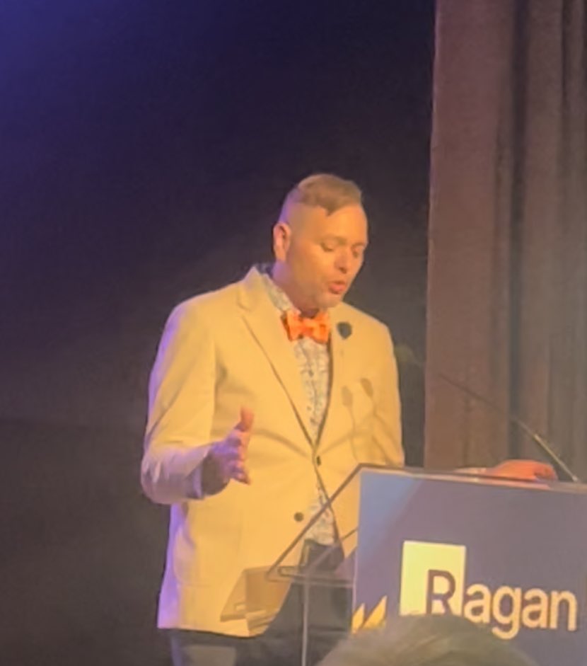 UAEWoman's tweet photo. The orange tie guy presenting the winner names.
#RaganAwards
#Chicago https://t.co/FedFPTfZMt
