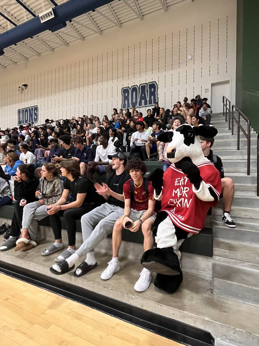 AshleeGraham84's tweet photo. The LIFE in a high school is unmatched. It was so great to hear all the kids rooting for their Ts in the RHS Student v Teacher 🏀 match! And these math Ts put a new spin on MATHLETES. 🤓💪🏼🤪 The kids also got a visit from a famous 🐮 we love! 🫶🏼 #RHSRoar #EatMorChikin @ReedyLions https://t.co/ZmQQAin5fK