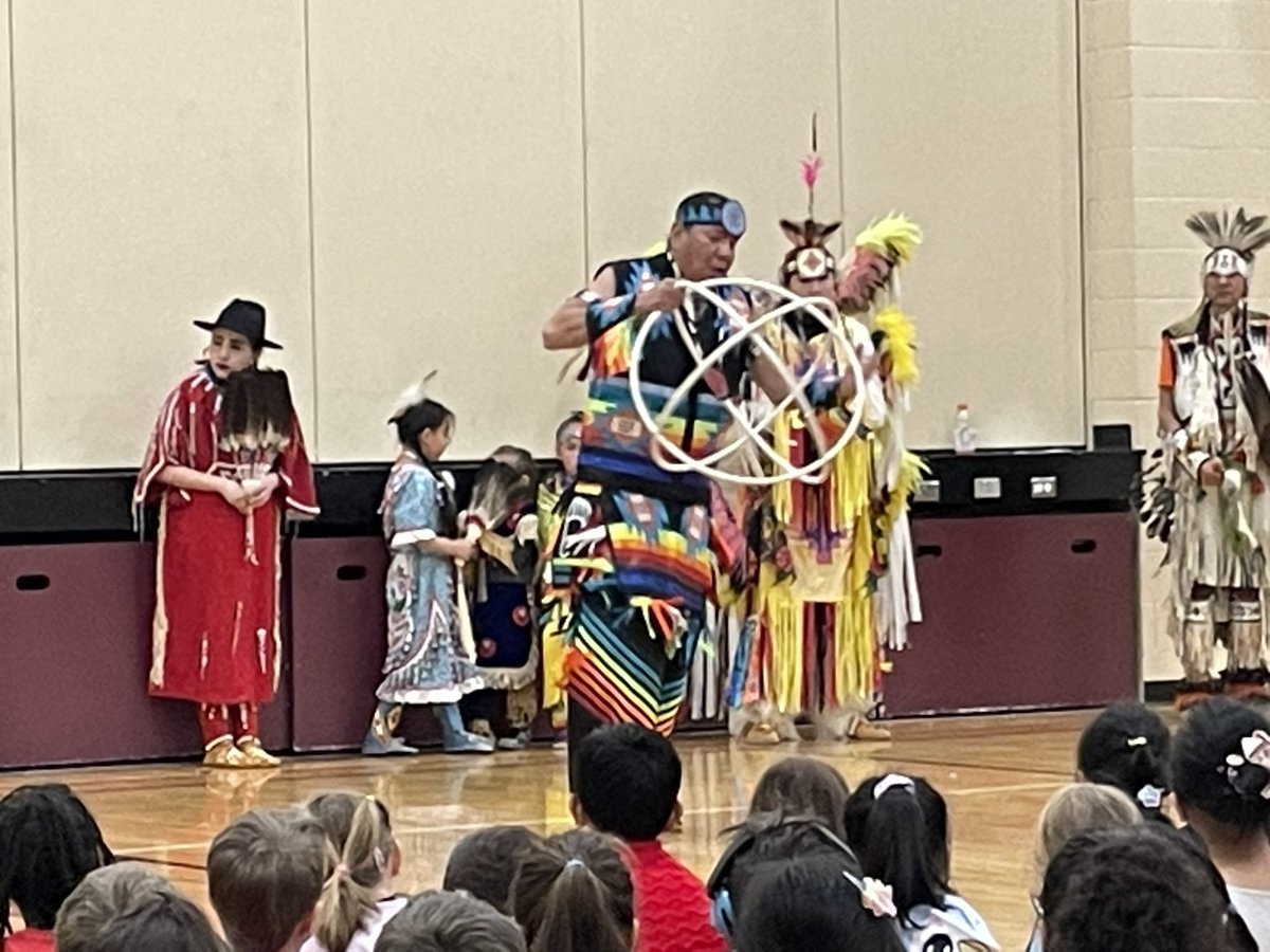 JohnstoneSchool's tweet photo. We hosted drummers and dancers from Tsuut’ina Nation today. Students, staff and parents enjoyed all of it- including a whole school round dance. Thank you Brown Bear Woman Events and JJSC/FJJSA for allowing this experience to happen! #WeAreCBE @Indigenous_cbe https://t.co/MEKVLp7UQp