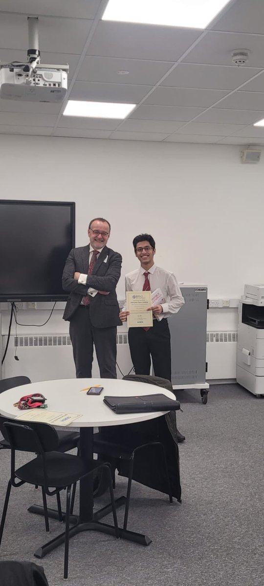 Fitzalan_NSA's tweet photo. Congratulations to the Fitzalan pupils celebrating their Physics Olympiad success. Thanks to Leo Ball for awarding their certificates. #Gold # Bronze @Seren_Network @Fitzalan_6form @NetworkSeren https://t.co/hF6QoIrzqB